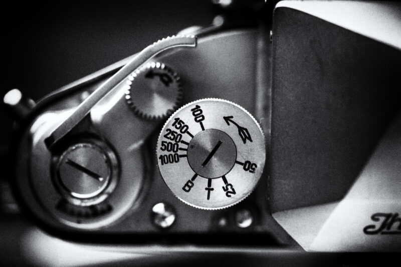 leave auto mode behind with private photography lessons top view of film camera dial