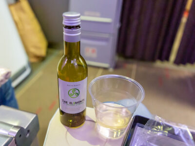 The champagne made me sleepy, so a little wine with dinner might help me sleep on the plane.