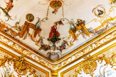 The Grande Singerie ceiling detail. This bedroom was decorated with mural paintings by Christophe Huet, depicting monkeys performing human actions, making fun of men and their foibles.
