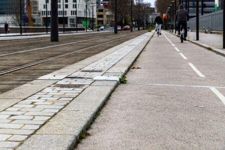 This is a very nice bike lane except for that teeny, tiny curb. Run your bike up against that curb and you're likely to end up face to face with the pavement. Ask me how I know.